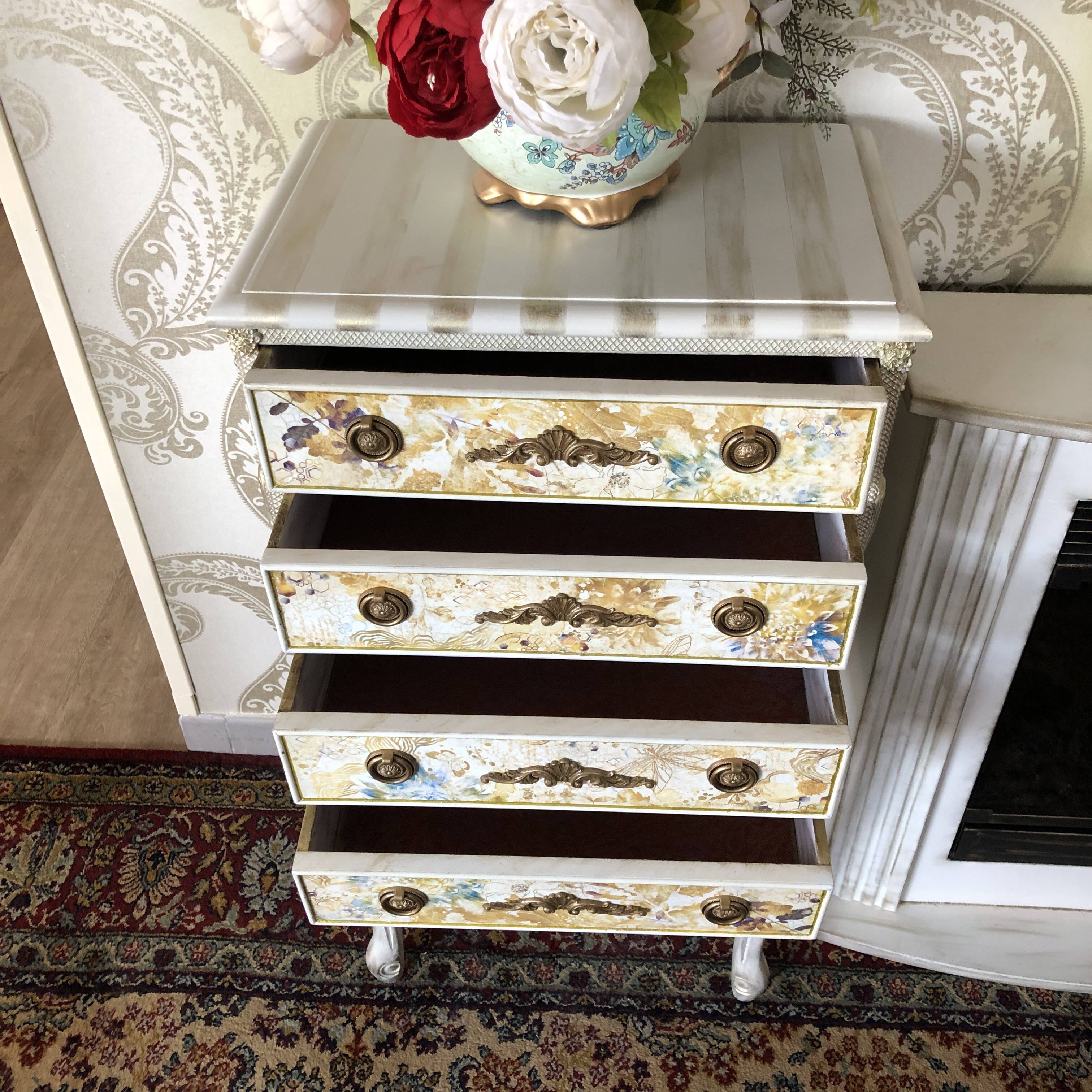 Vintage commode refurbished with 4 drawers in classic style with floral decor.