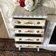 Vintage commode refurbished with 4 drawers in classic style with floral decor.