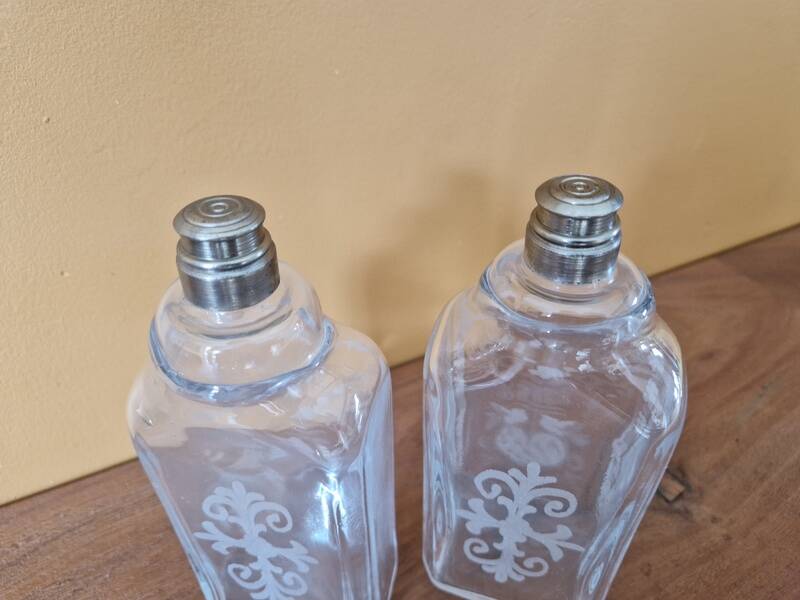 Pair of old engraved and frosted glass bottle vases.