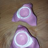 A pair of pink earthenware candlesticks (1940s–50s)