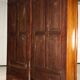 Antique walnut wardrobe with glass and carvings, Italy, 19th century.