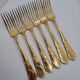 12 Table Forks in gold metal