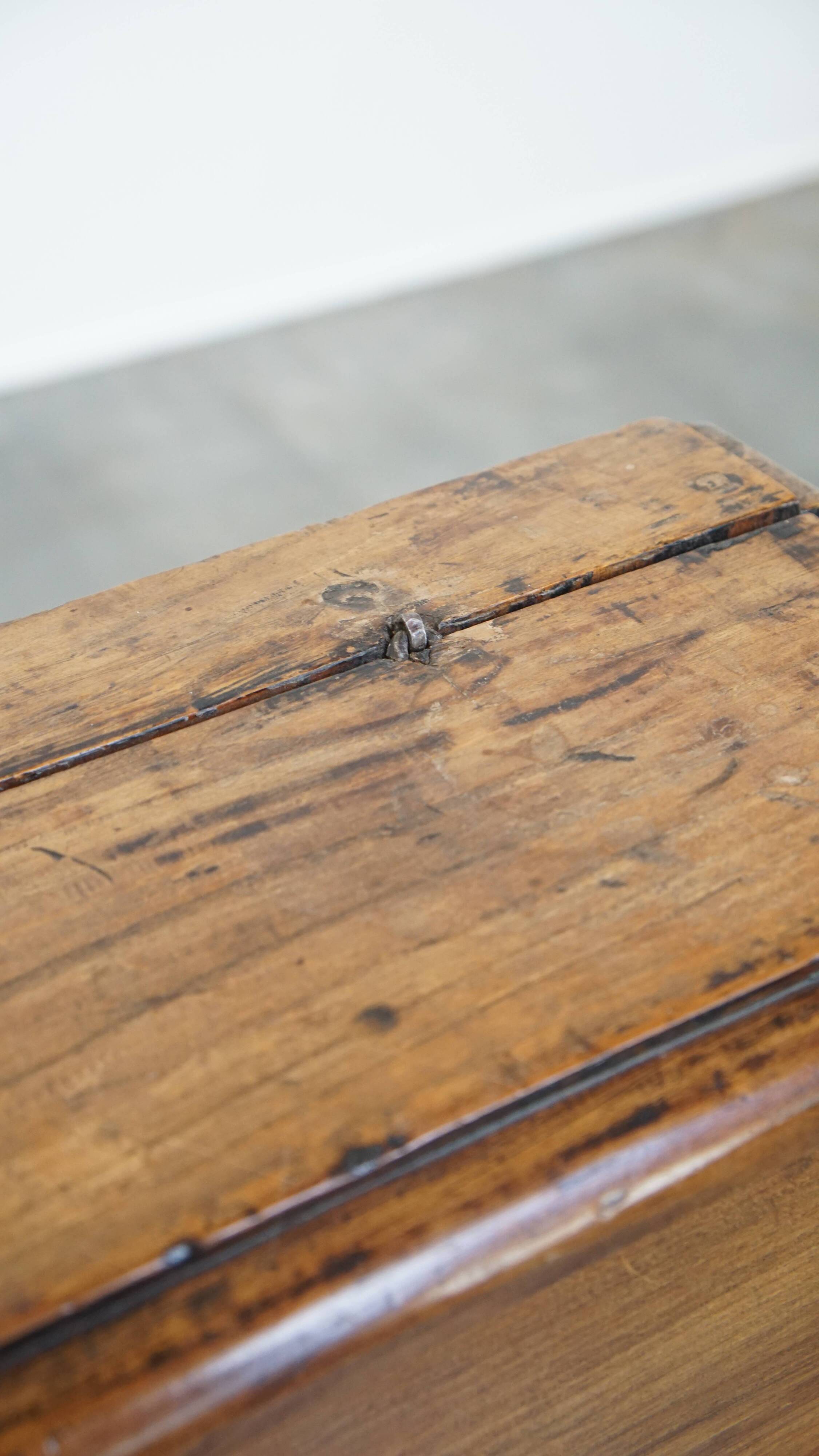 Antique pinewood church pew with storage compartments from the 18th century