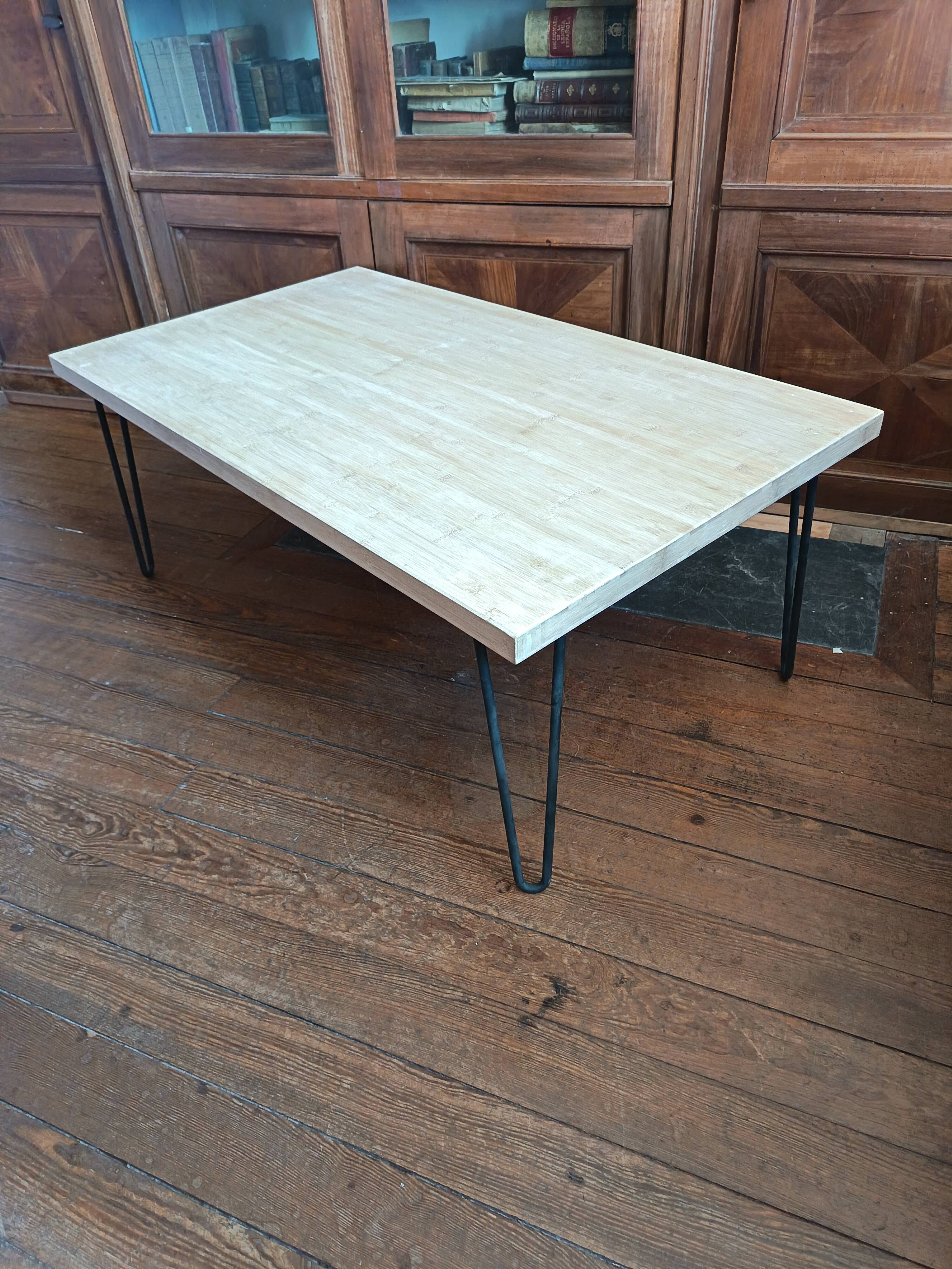 Coffee table in solid bamboo with steel legs.