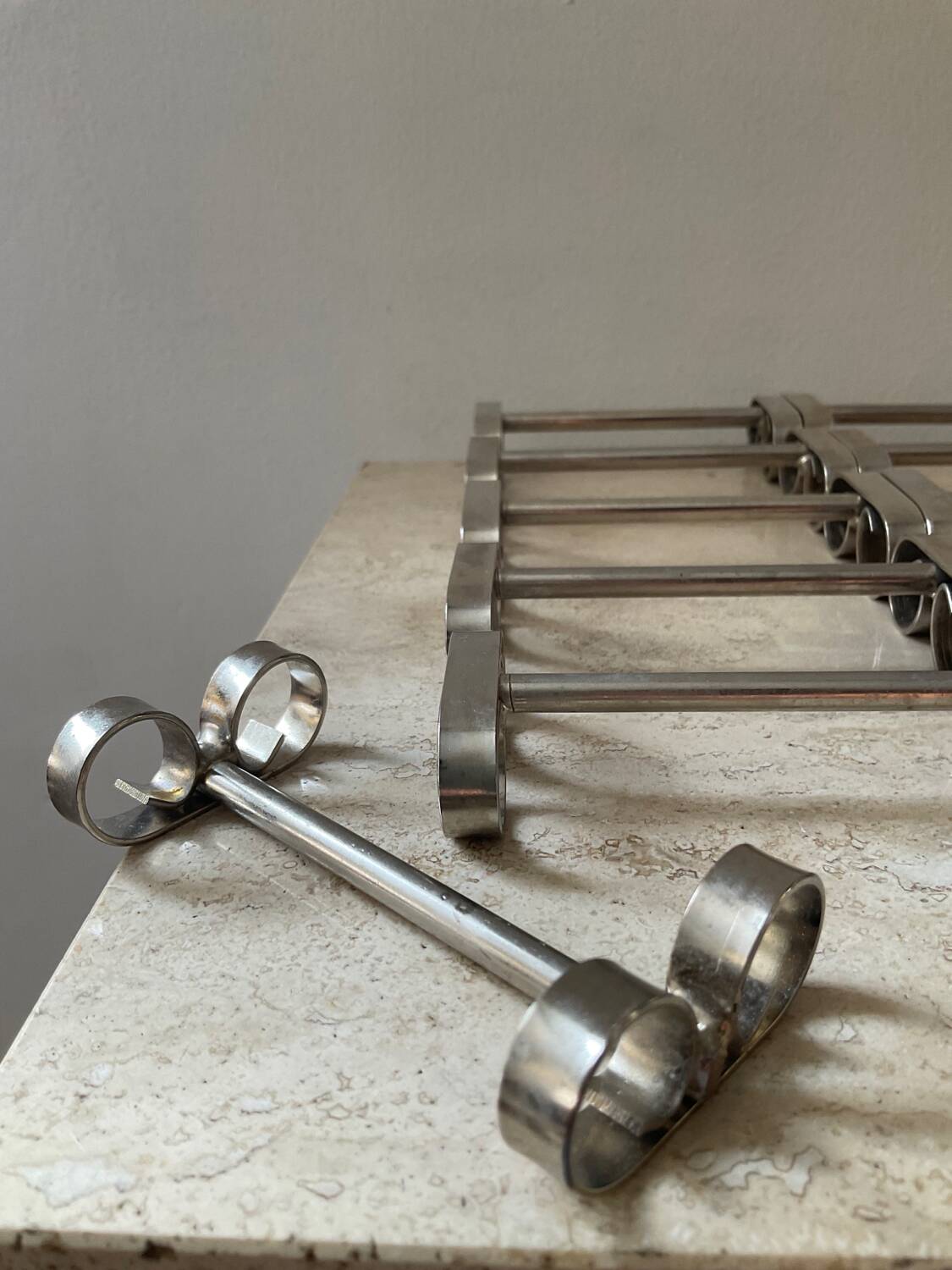 Series of 12 vintage stainless steel knife holders