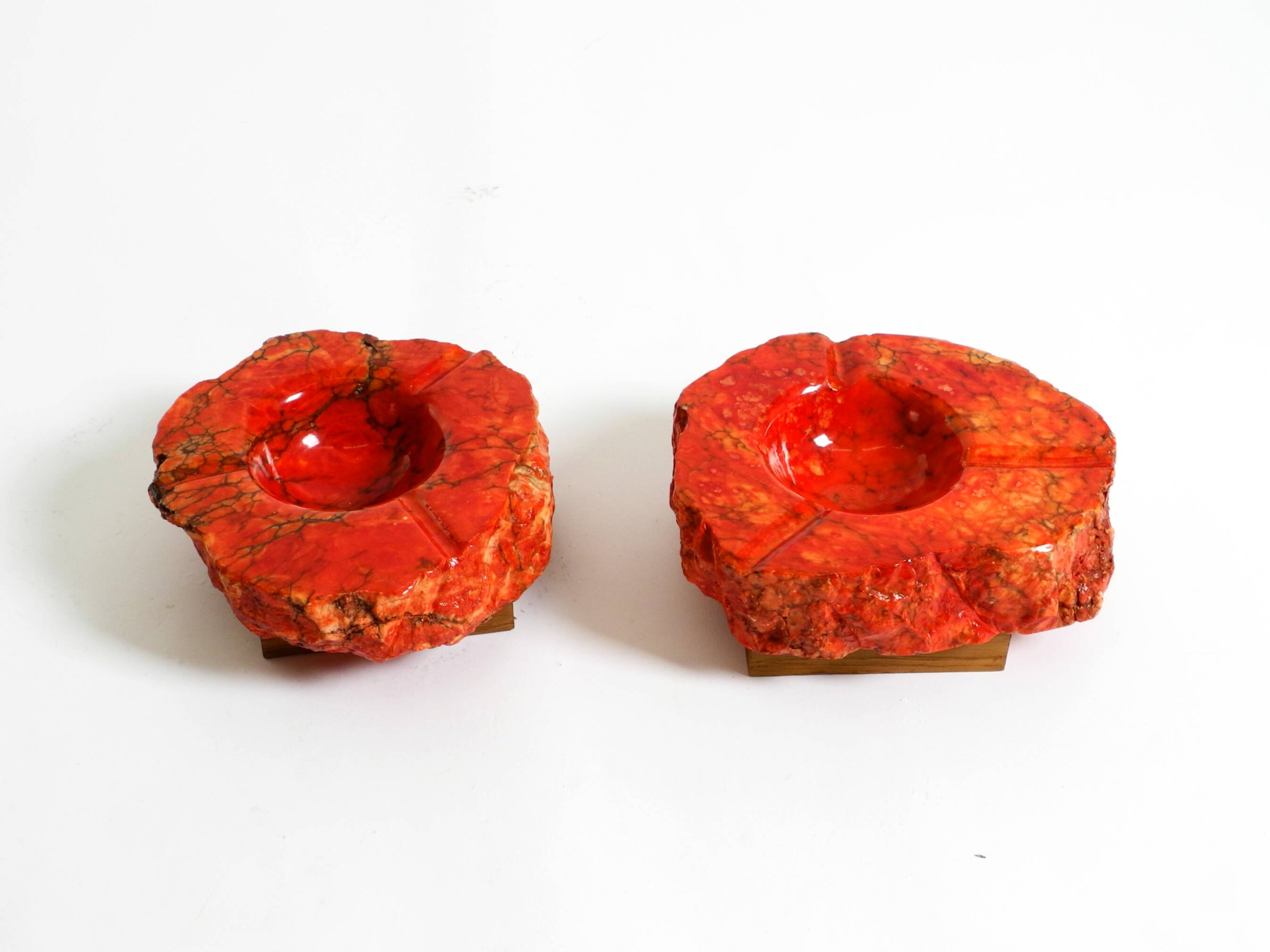 Two mid-century standing ashtrays consisting of red Alabaster cup