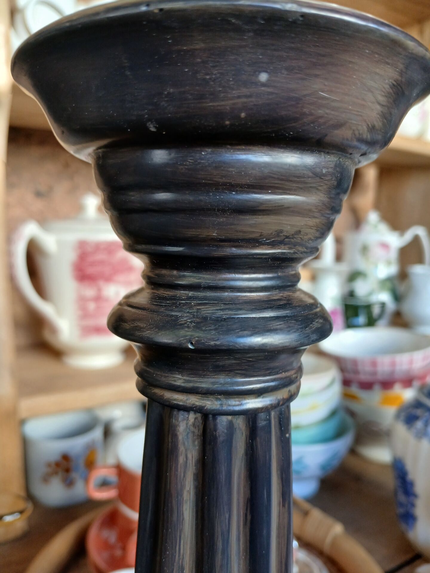 2 carved wooden candlesticks