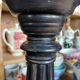 2 carved wooden candlesticks