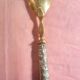 SILVER DESSERT SPOON, hallmarked ? chiseling on the spoon