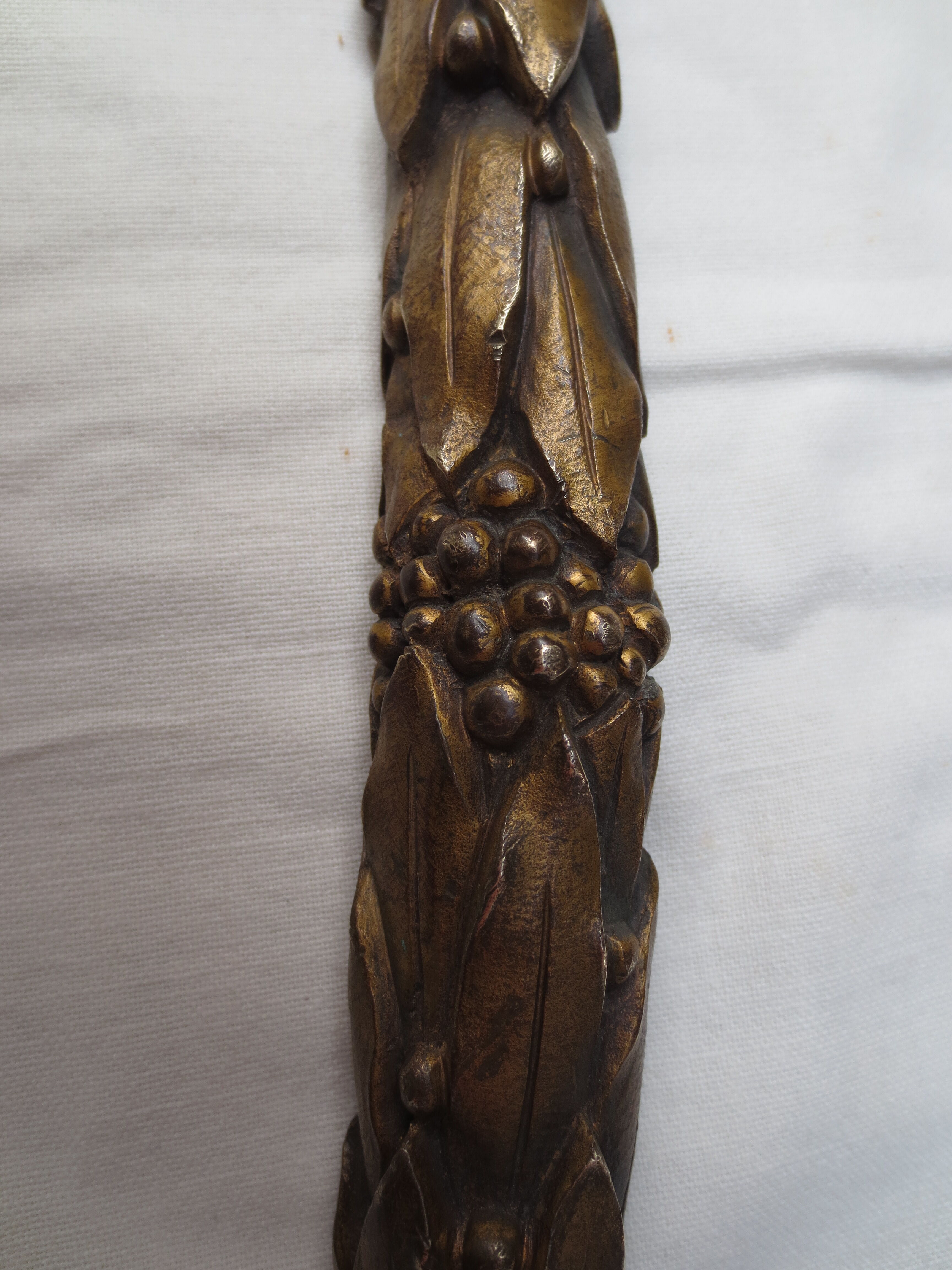 old bronze curved pediment