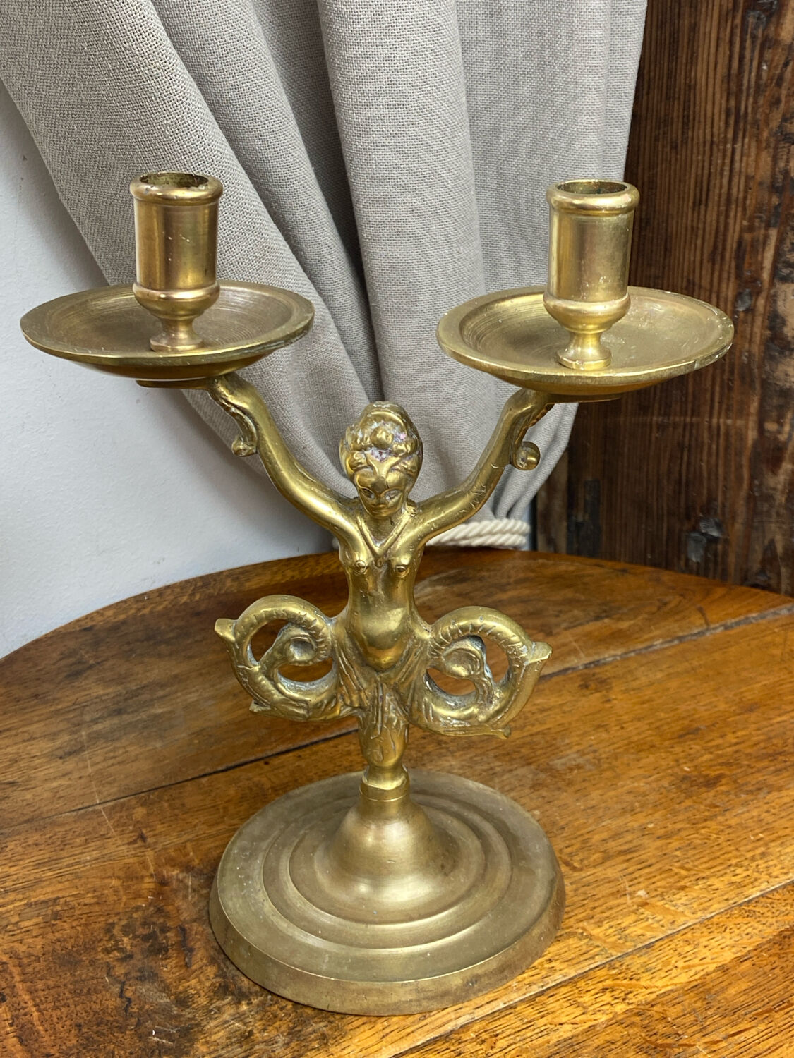 Mermaid-shaped chandelier in bronze