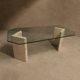 Dining table in travertine and smoked glass.