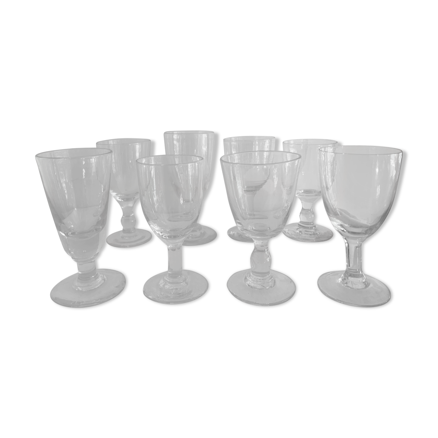 8 old blown and different foot wine glasses