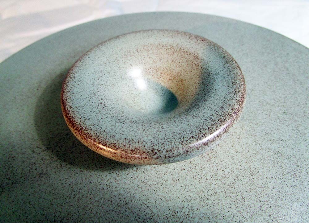 Sandstone cheese platter and bell