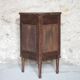Antique wooden corner cabinet with a curved door.