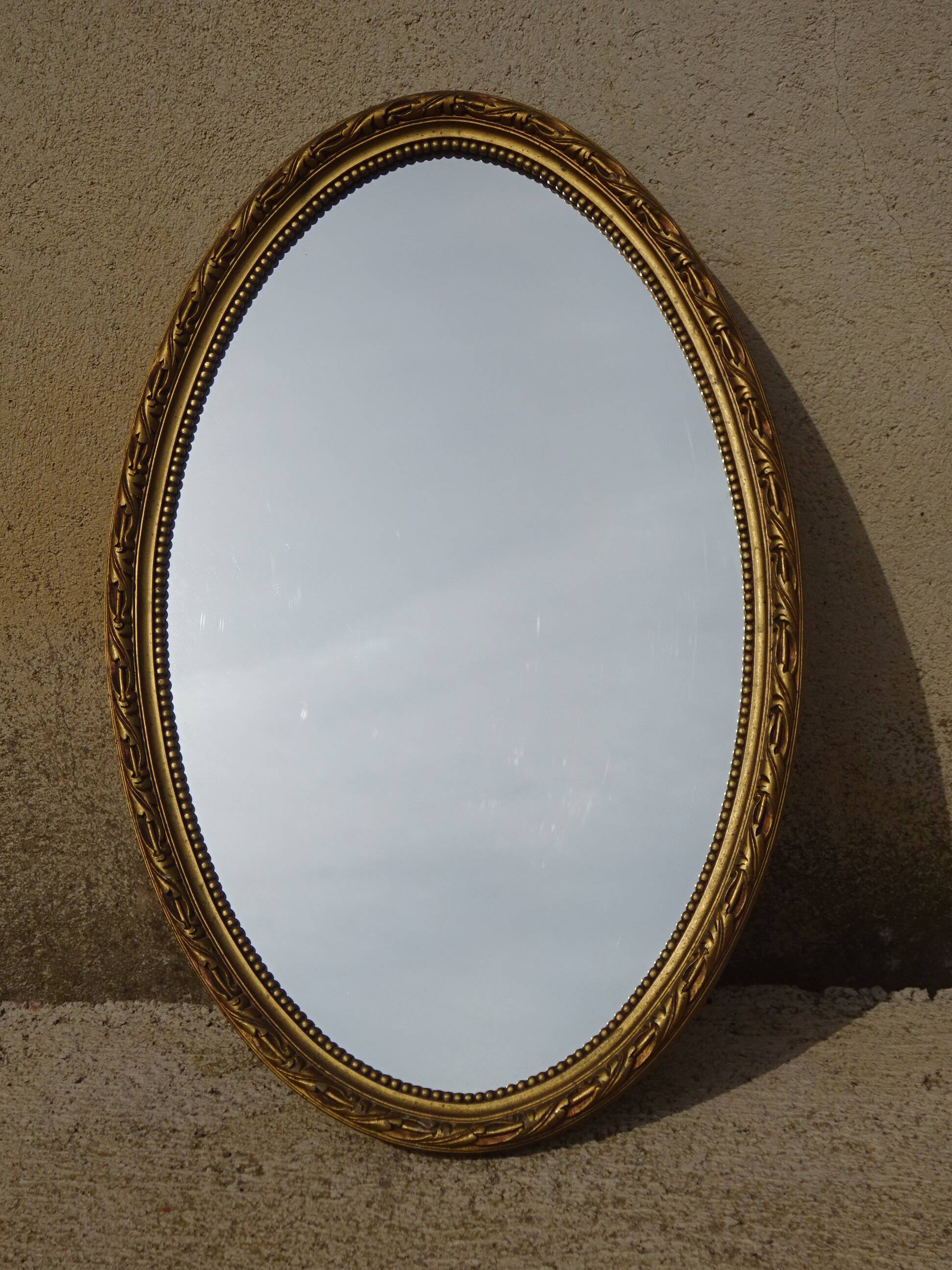 Louis XVI style golden medallion mirror, 63x41 cm