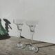 Pair of clear glass candlesticks, signed