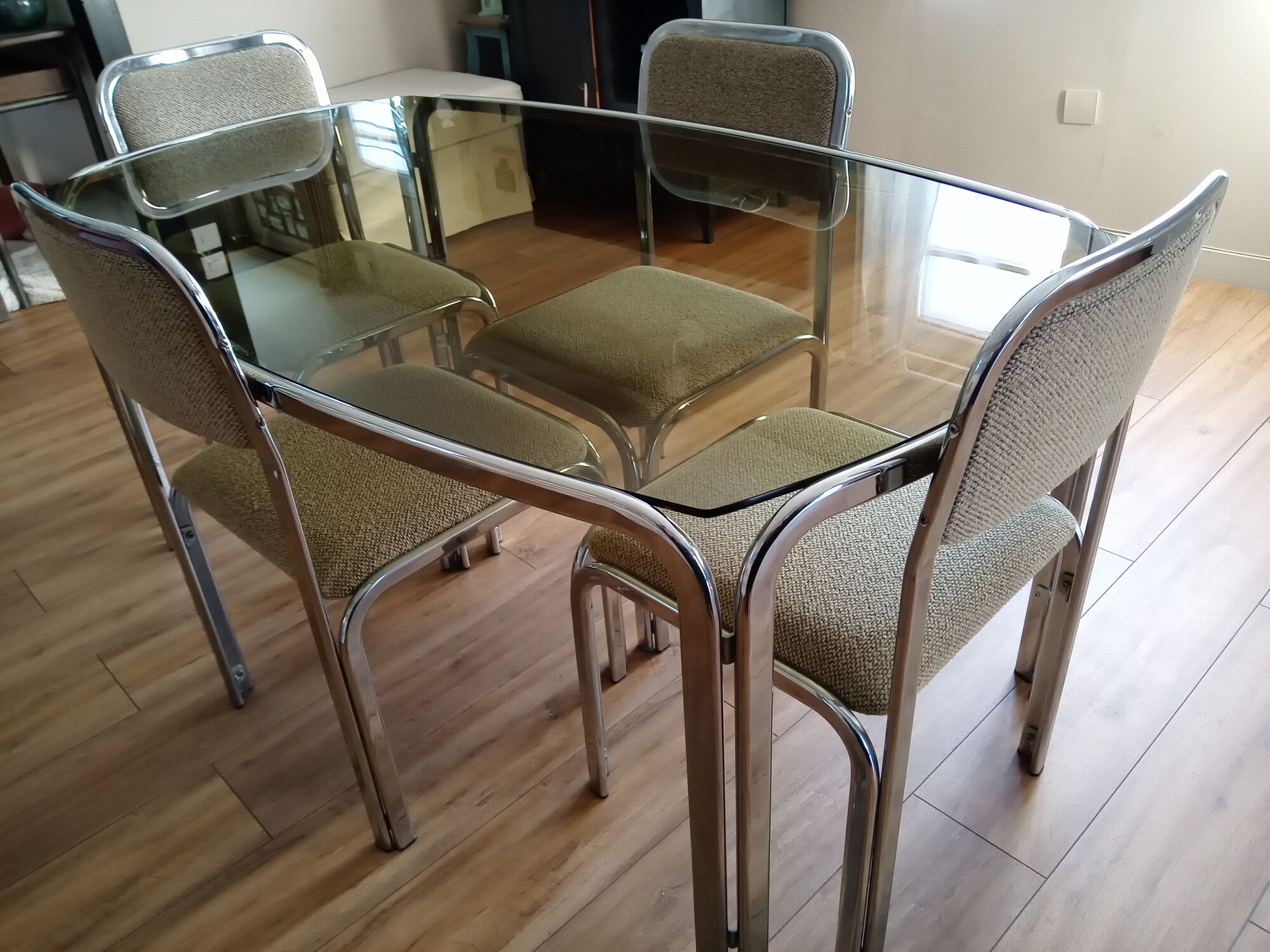 Table and 4 70s chairs chrome base and smoked glass tray chairs green water fabric