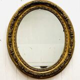 Large golden oval mirror