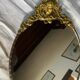 Antique bronze oval mirror
