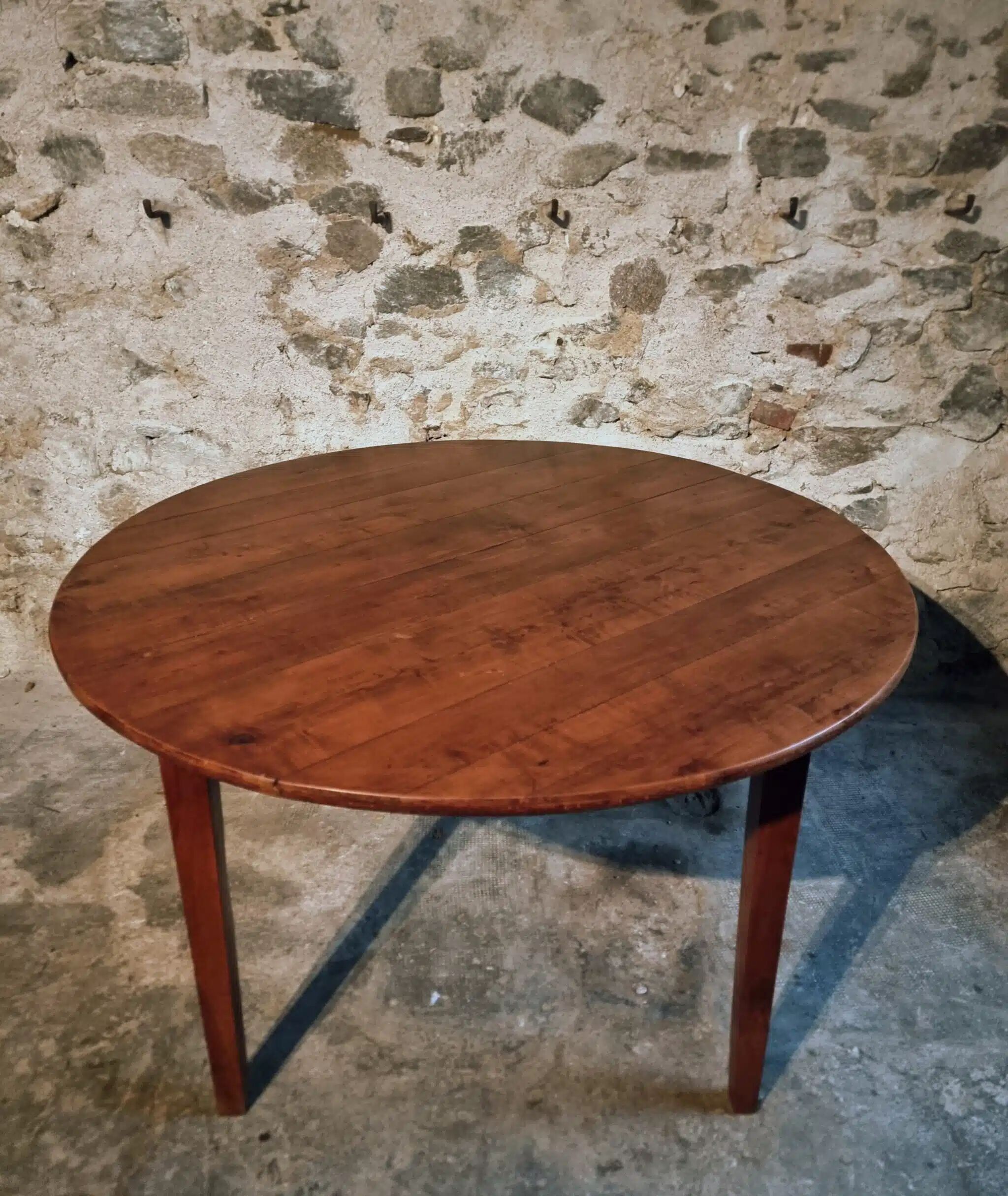 Vintage French round dining table in cherry wood, circa 1920.