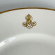 Service d’assiettes à bord doré, monogrammées | E. Bourgeois | Fin XIX