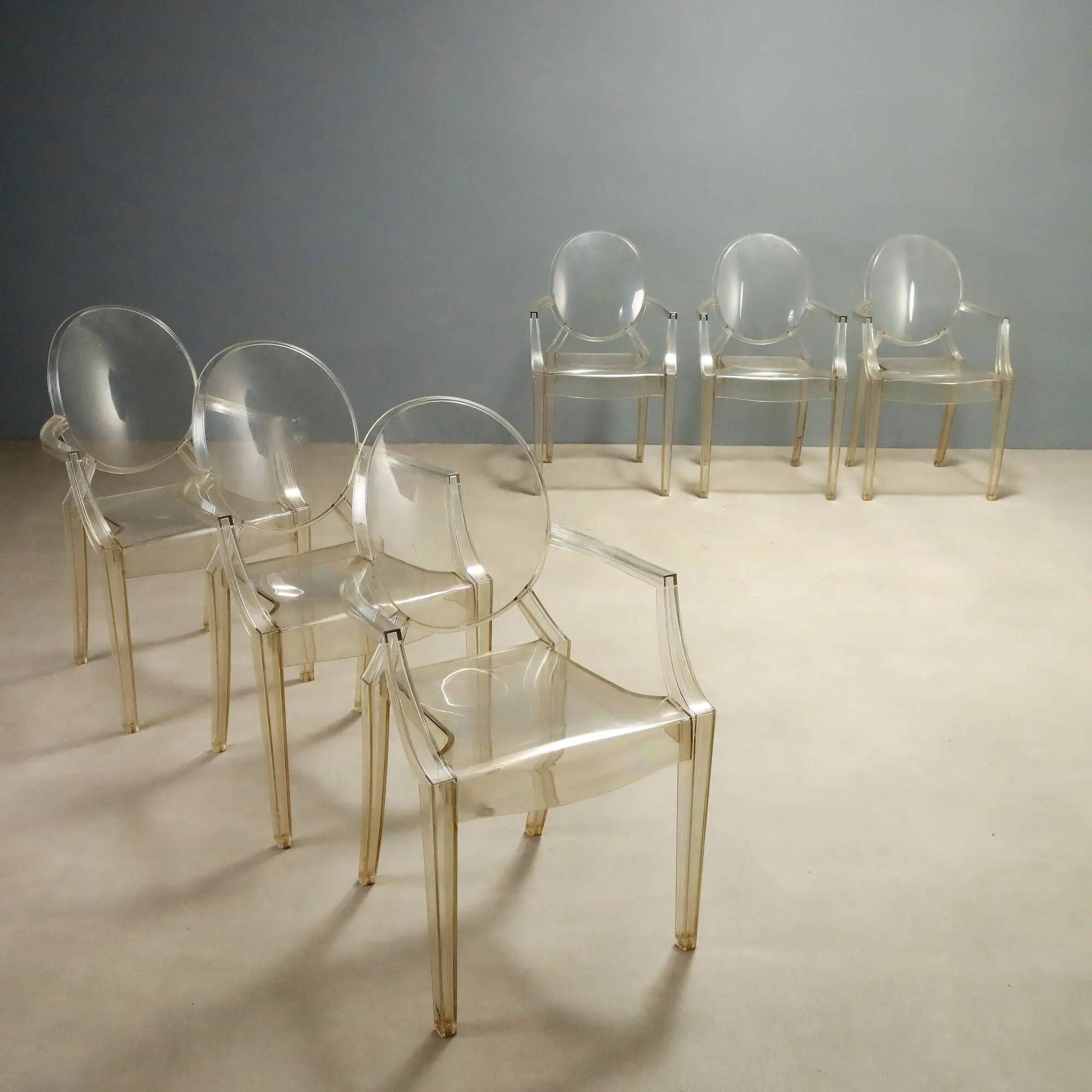 Louis Ghost chairs by Kartell designed by Philippe Starck from the 2000s.