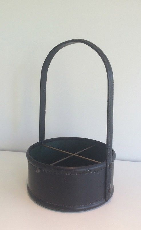 Leather wall magazine rack. In the style of Jacques Adnet.