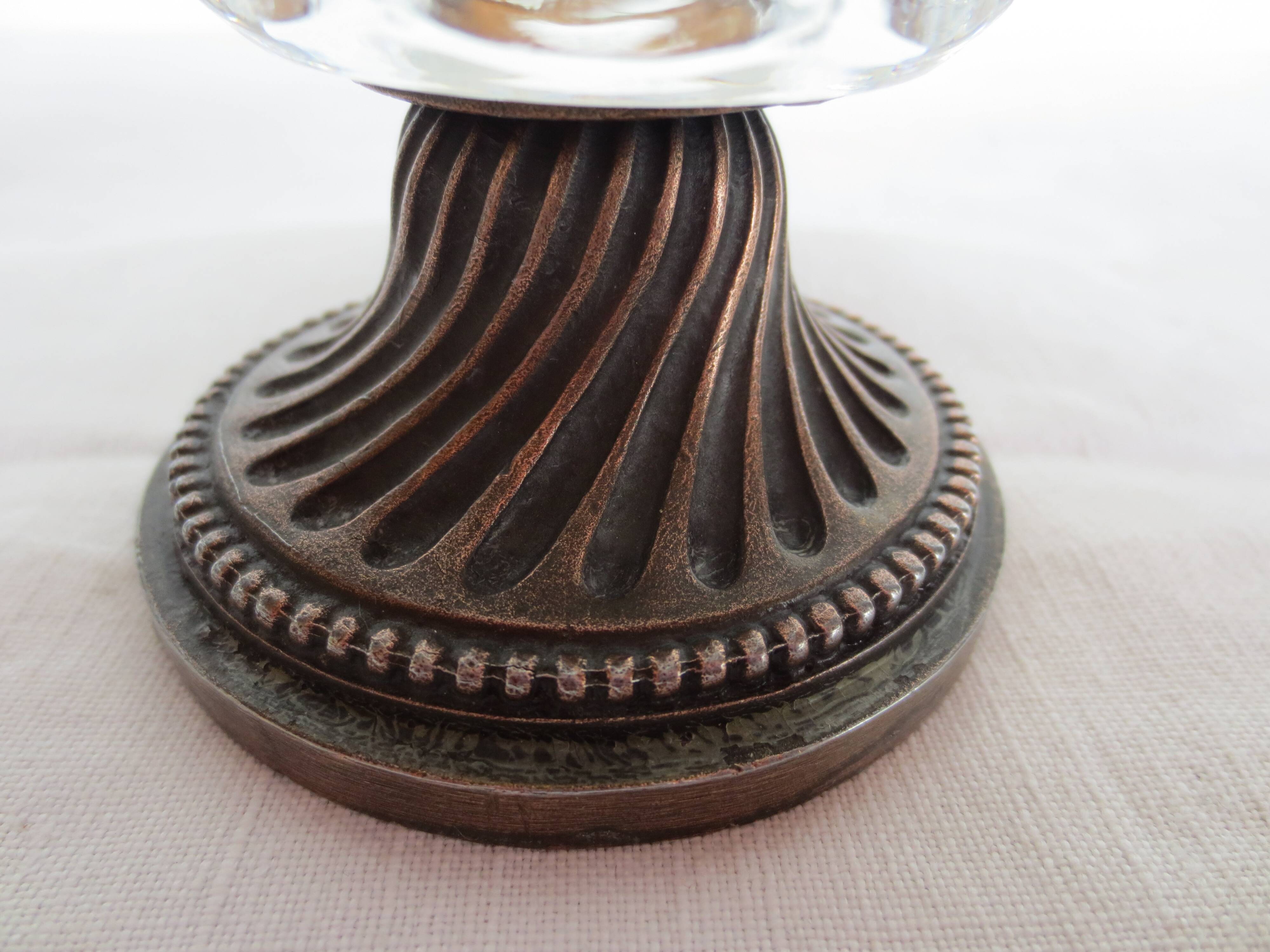 Two candle holders in bronze and crystal