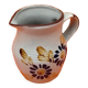 Glazed ceramic pitcher floral decoration