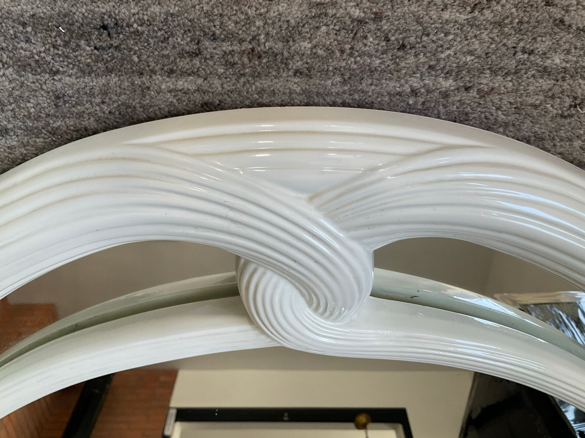Vintage Art Deco style mirror in stained white wood.