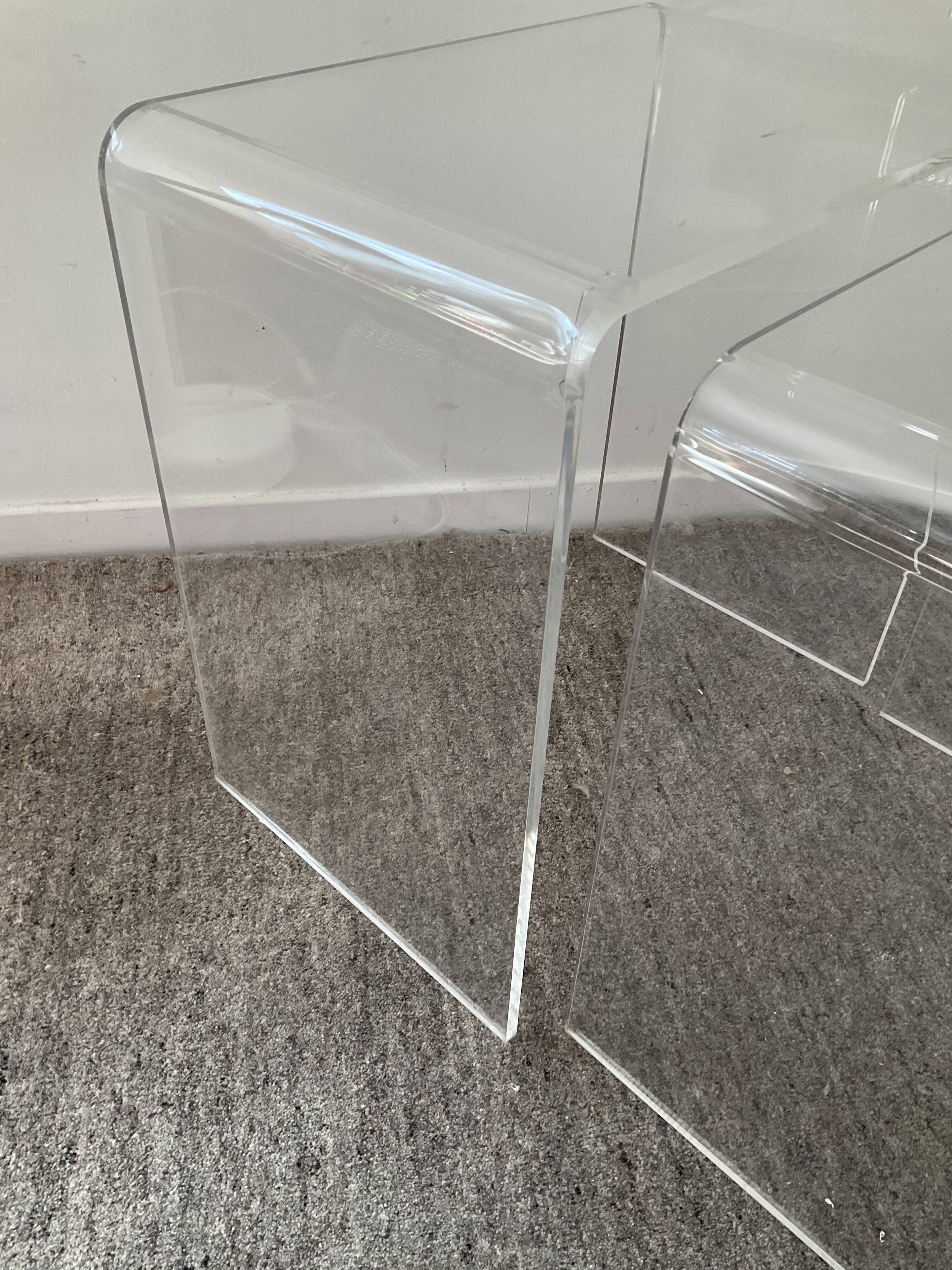 Duo of pull-out tables in plexiglass 70s