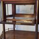 Art Deco service trolley in mahogany, brass, and glass, 1920.