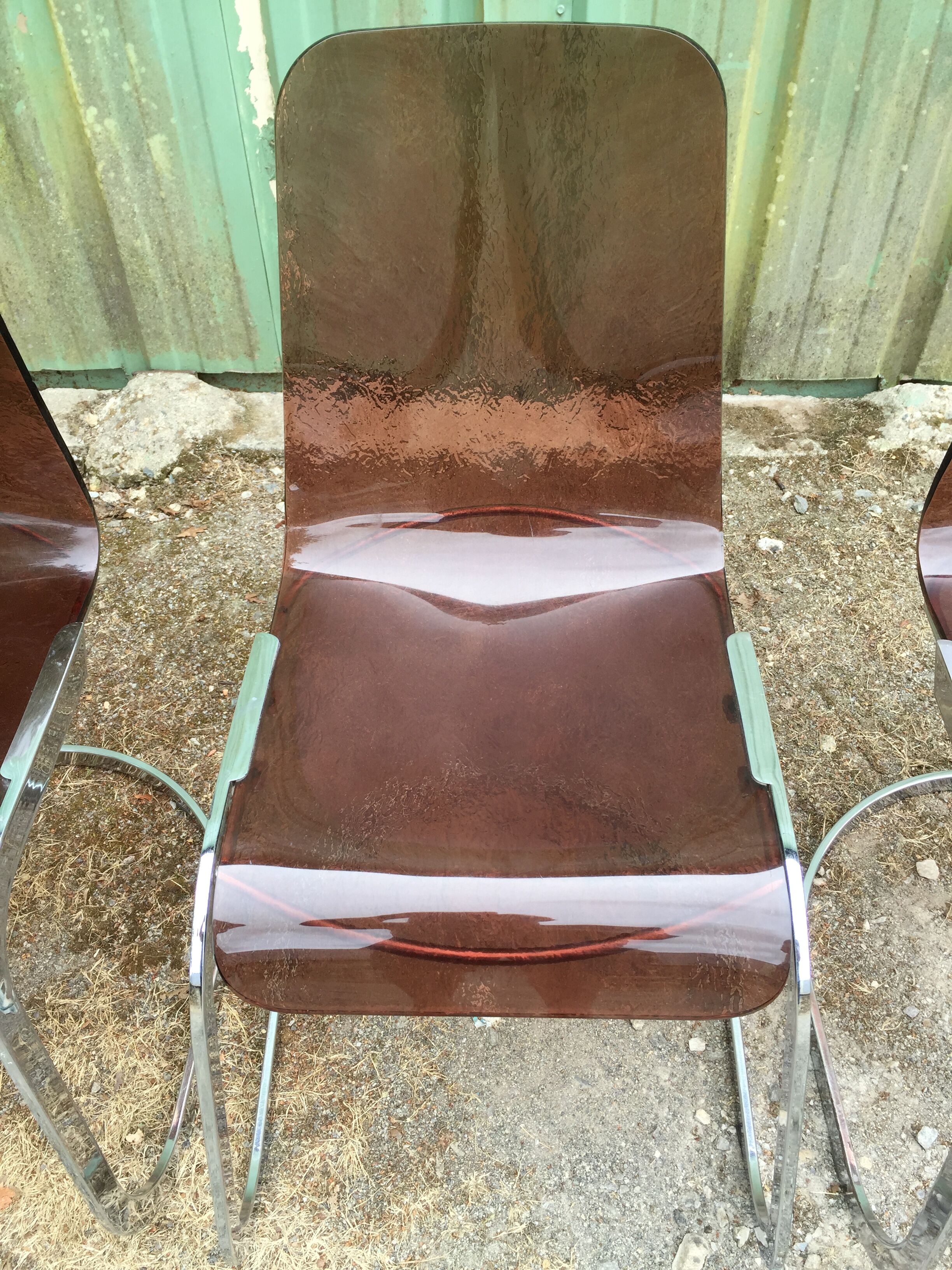 Chairs in plexiglas with chrome metal base