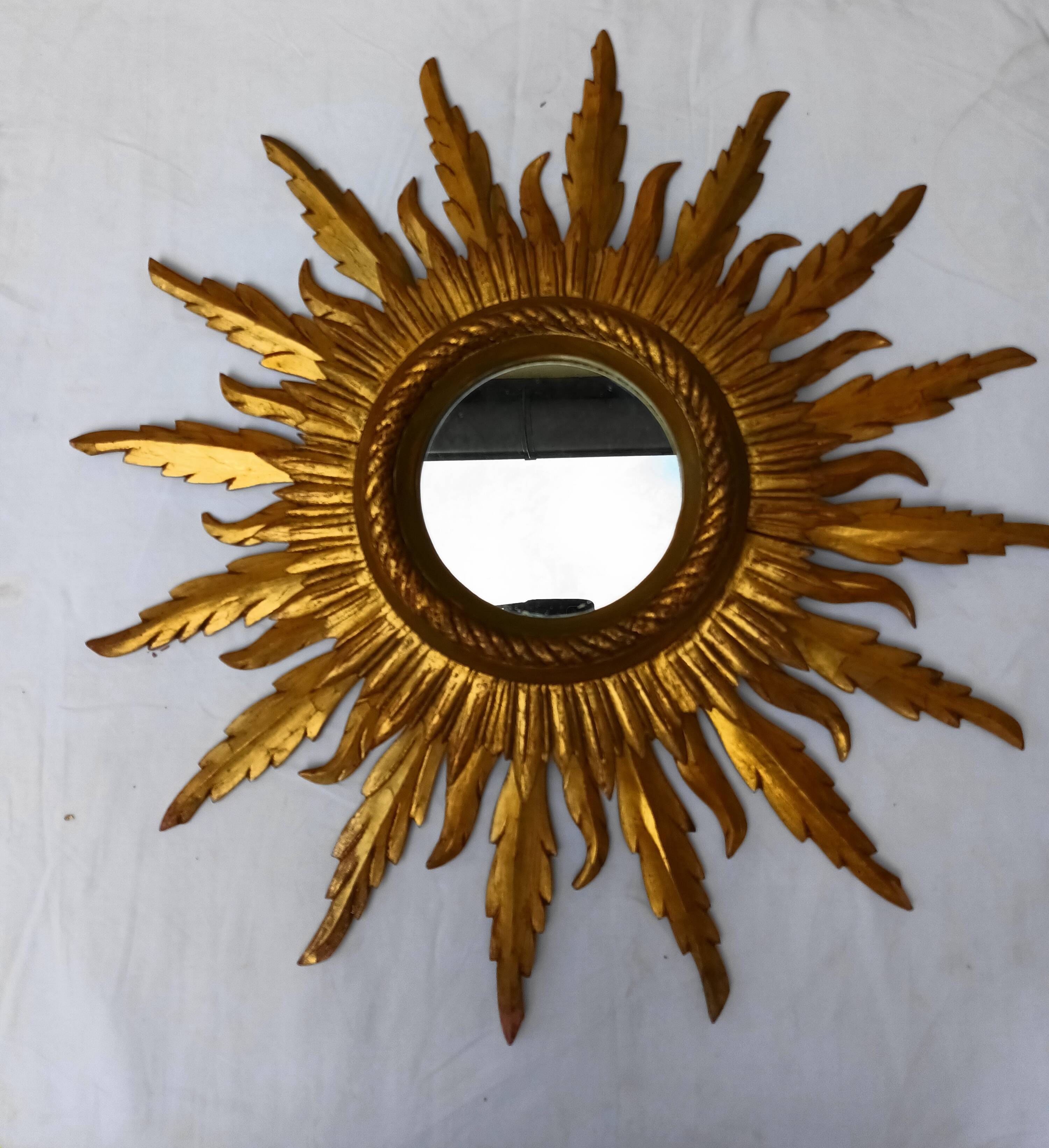 Sun mirror in carved gilded wood from the 1950s