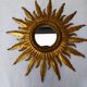 Sun mirror in carved gilded wood from the 1950s