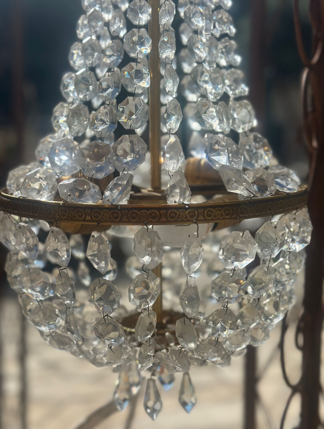 Basket chandelier with crystal and gilded brass pendants, circa 1930.