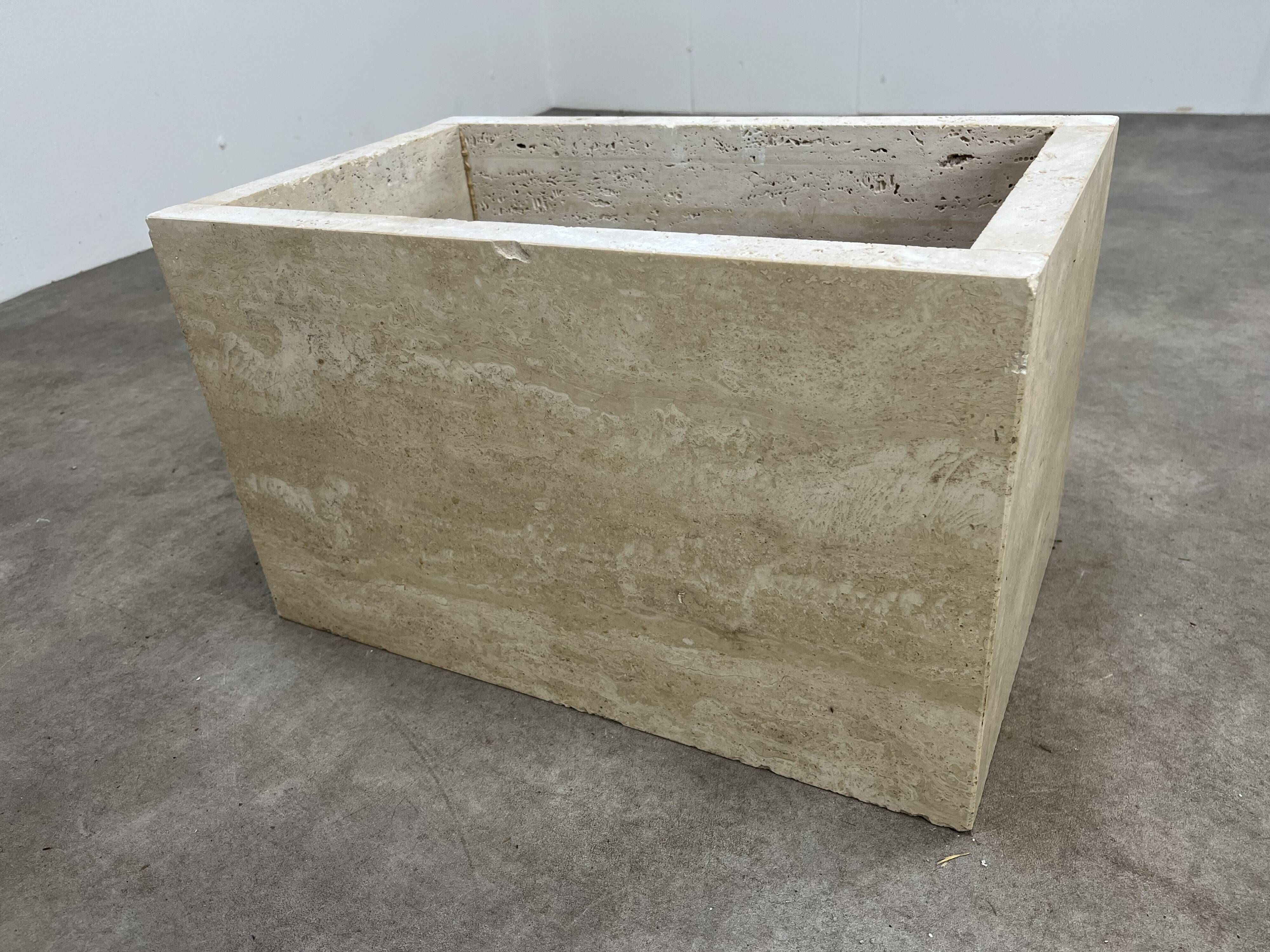 Rectangular travertine coffee table with central leg