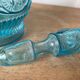 Old turquoise blue molded glass carafe
