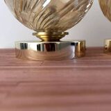 Pair of golden globe wall lights