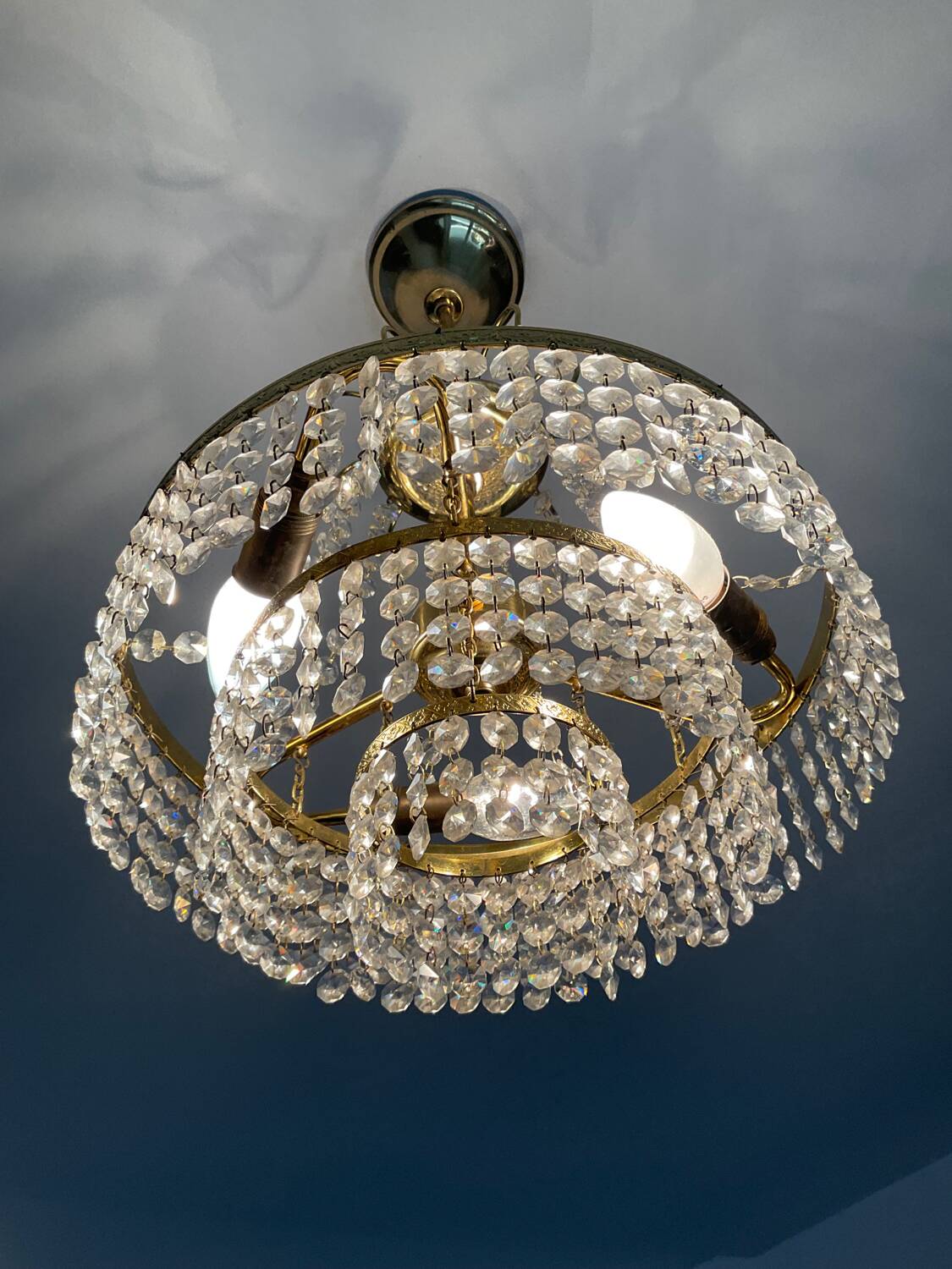 Cascade chandelier with crystal and brass tassels
