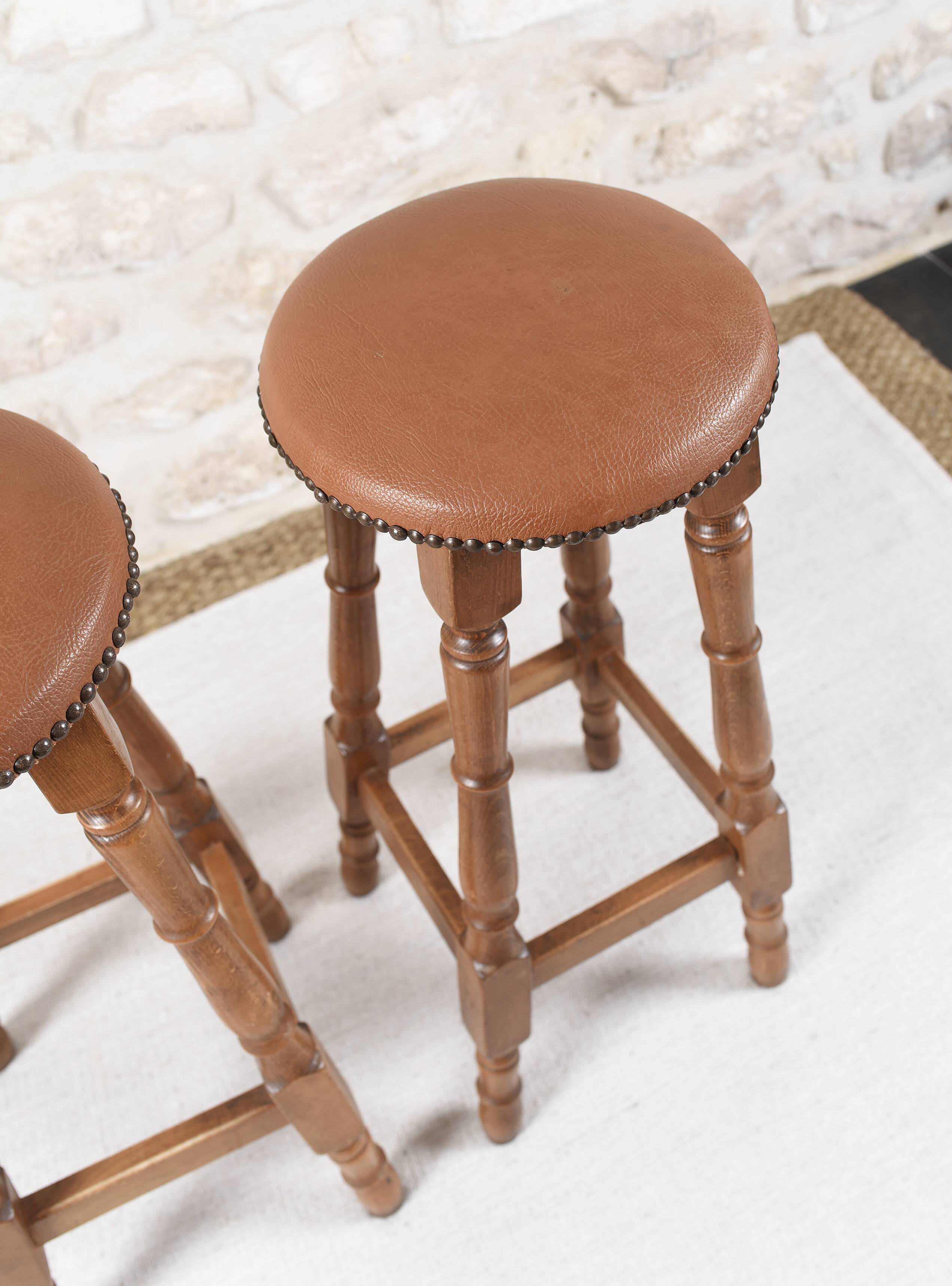 Antique bar stools, brown leather and wood
