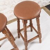 Antique bar stools, brown leather and wood