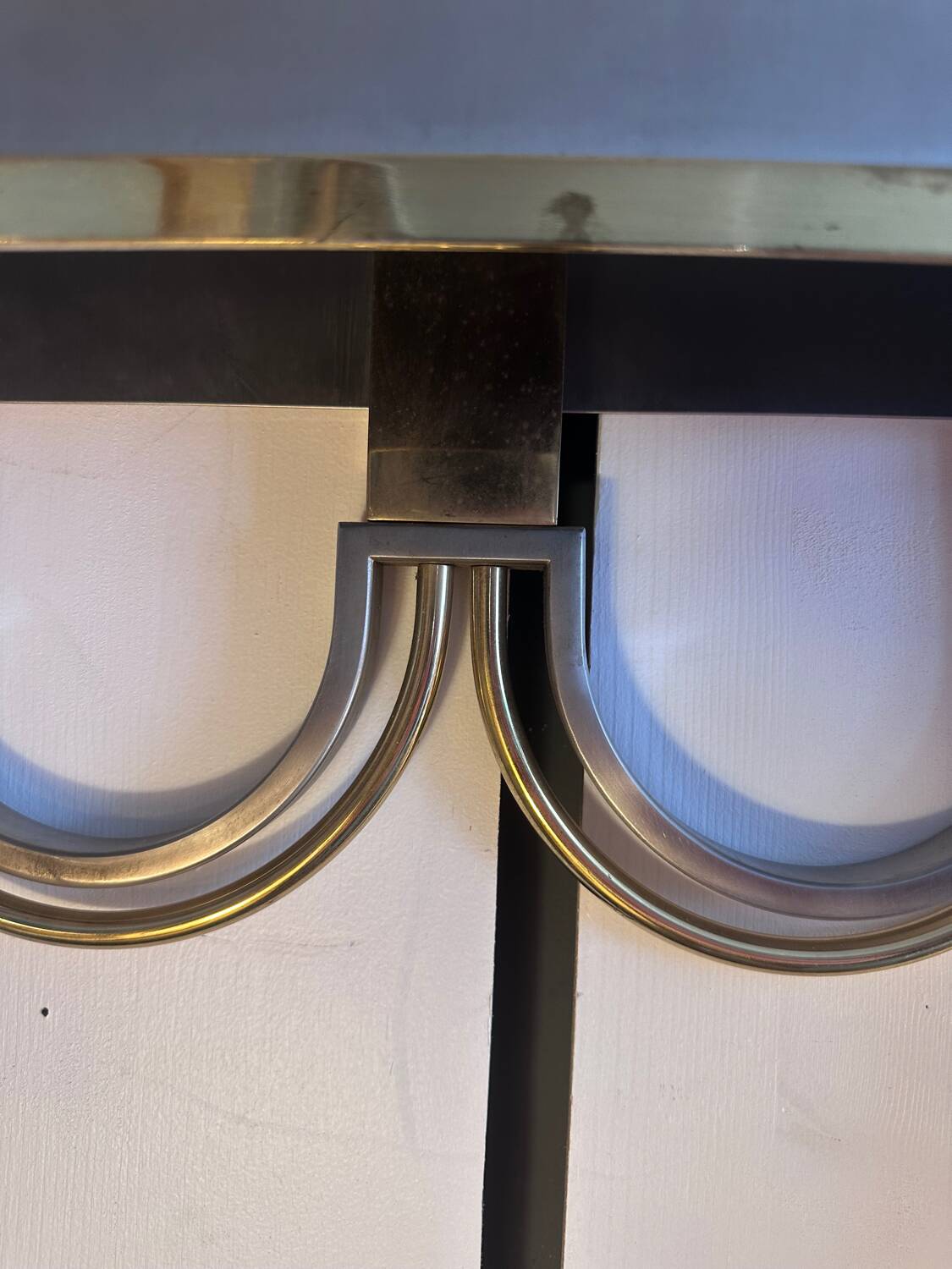 Pair of stainless steel and brass wall lights