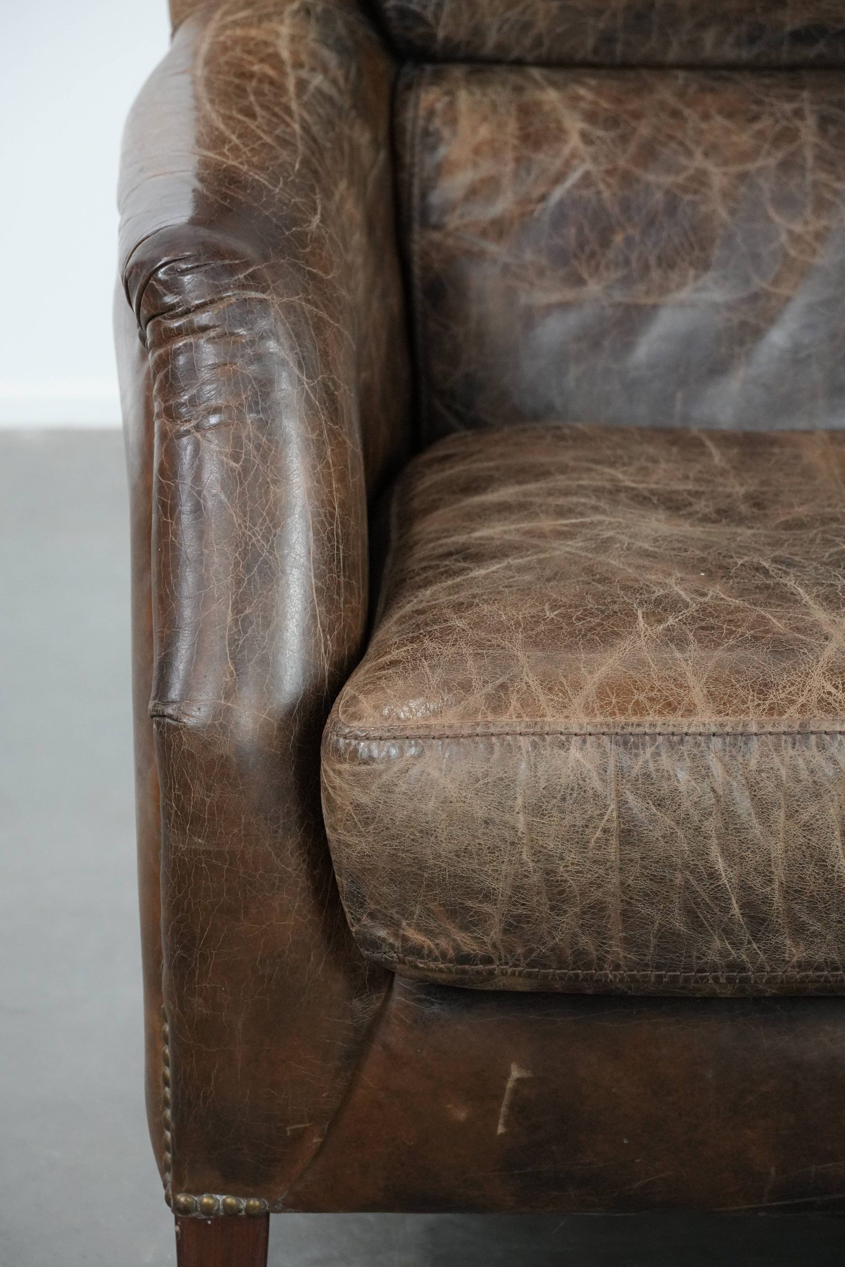Very comfortable vintage cow leather armchair with character