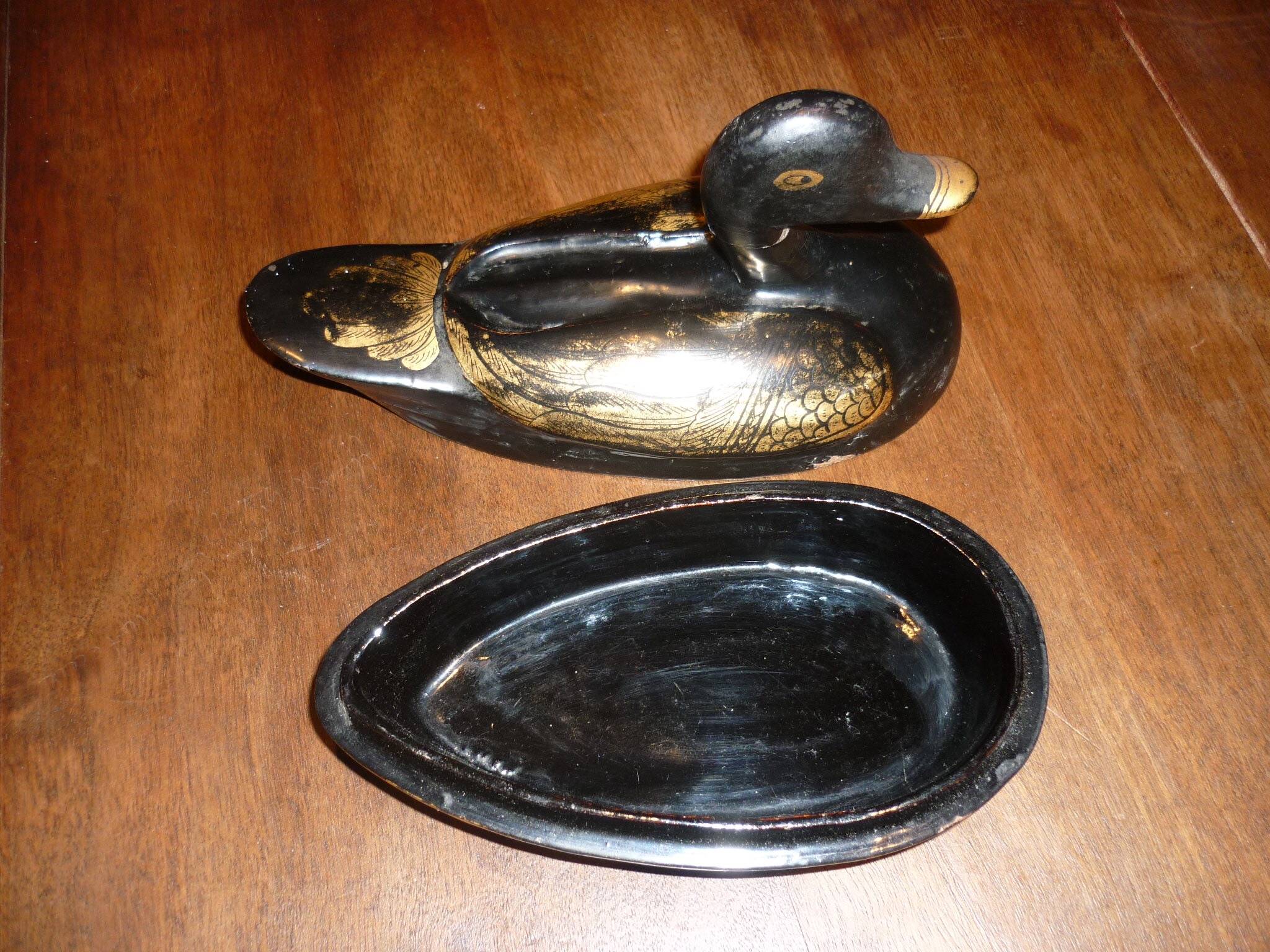 Black and gold wooden duck