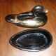 Black and gold wooden duck