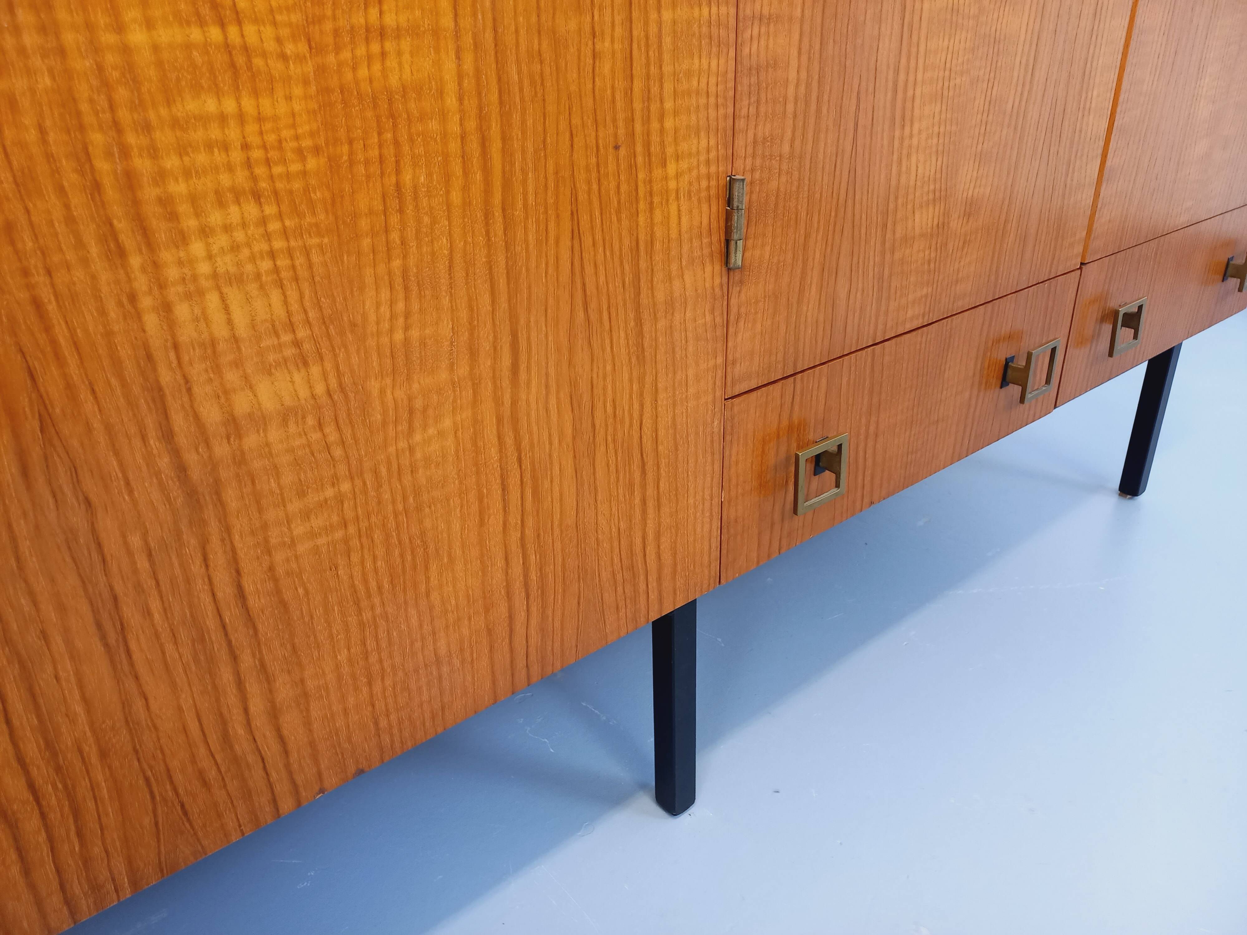 Vintage modernist wardrobe in teak and metal from the 1960s.