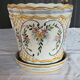 Earthenware cachepot, hand-decorated with floral motifs and scrolls