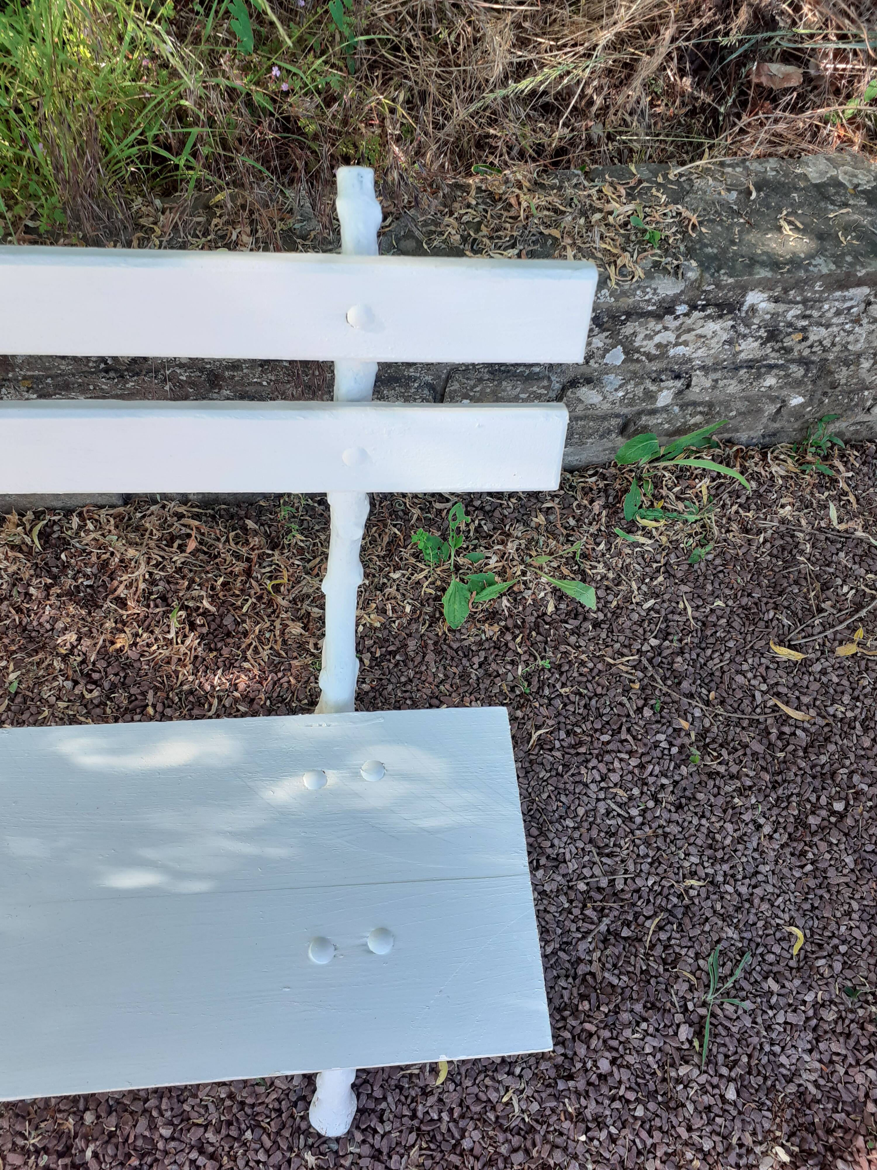 Old garden bench with cast iron feet and wooden planks